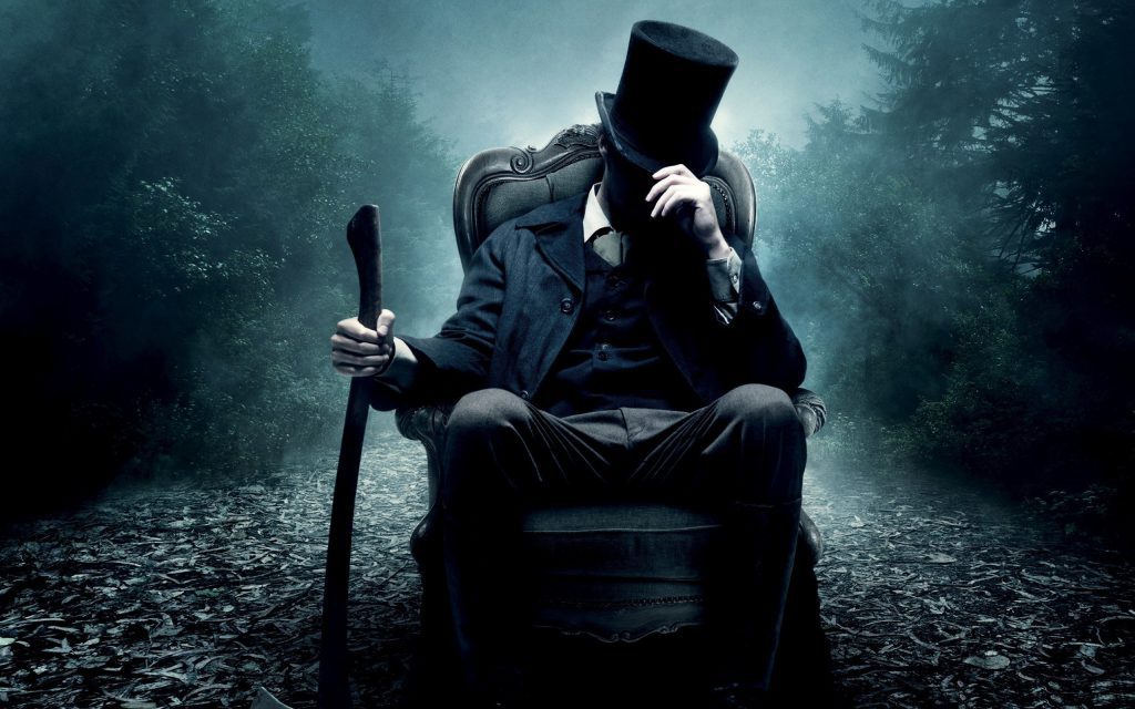 Cool Abraham Lincoln Wallpaper - sitting in a chair with an axe