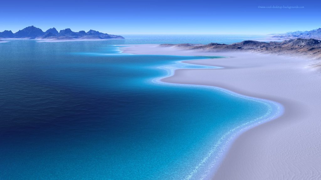 blue ocean scene with a sandy beach and sand dunes