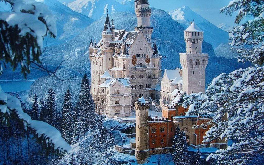 Snowy Castle Wallpaper - castle in the winter covered in snow, mountains in the background - winter wallpaper